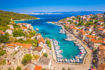 A picturesque view of Stomorska on Solta Island, Croatia, featuring its scenic harbor, moored...