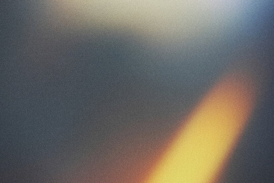 Golden flames light leak on black background.