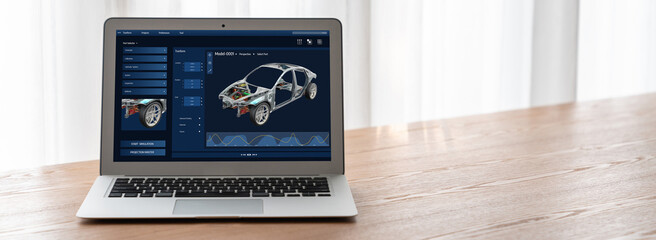 Electric car design software on computer screen showing simulation blueprint snugly by digital calculating application for manufacturing preparation