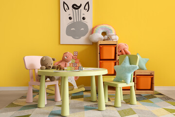 Interior of stylish playroom with toys in kindergarten