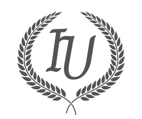 Initial letter I and U, IU monogram logo design with laurel wreath. Luxury calligraphy font.