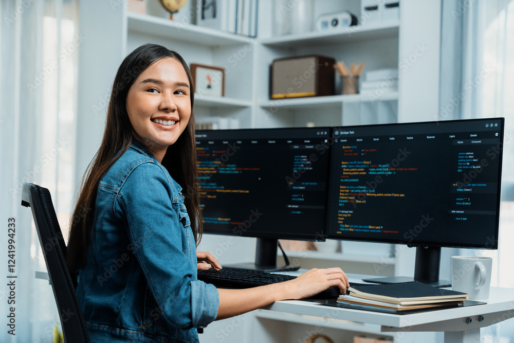 Poster young asian in it developer looking at camera to present with online information on pc with coding p