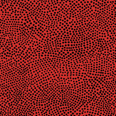Seamless pattern of irregular black polka dots on red background