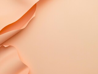 Peach-colored canvas material forming elegant waves provides a textured and artistic backdrop with ample copy space, ideal for design projects or presentations