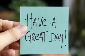 Sticky Notes with 'Have a Great Day' on Colored Paper