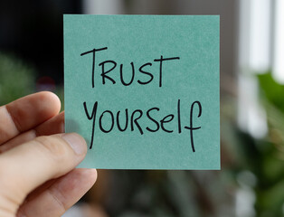 Sticky Notes with 'Trust Yourself' on Colored Paper