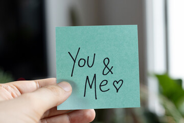 Sticky Notes with 'You and Me' on Colored Paper