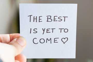 Sticky Notes with 'The Best is Yet to Come' on Colored Paper