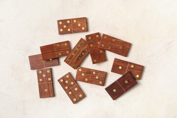 Wooden dominos blocks on white grunge background