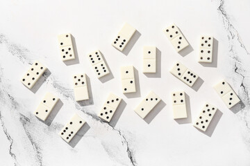 White dominos blocks on marble background
