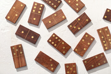 Many wooden dominos blocks on white background