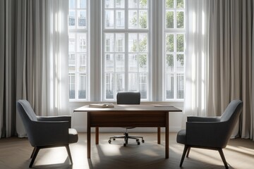 Sunlit office with large windows, wooden desk, and two armchairs.