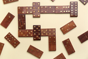 Many wooden dominos blocks on light background