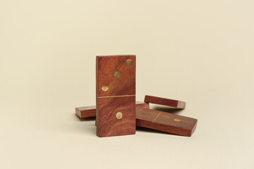Wooden dominos blocks on light background