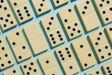 White dominos blocks on blue background