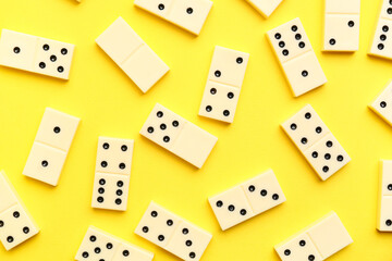 White dominos blocks on yellow background
