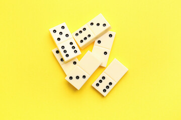 White dominos blocks on yellow background