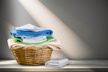 stack of colorful fresh clean clothes on desk