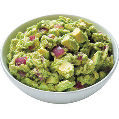 A creamy bowl of guacamole featuring mashed avocados, diced onions, and chunks of tomato.