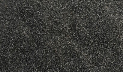 Coarse black salt. Background of black salt.
The texture of coarse-grained black salt with a...