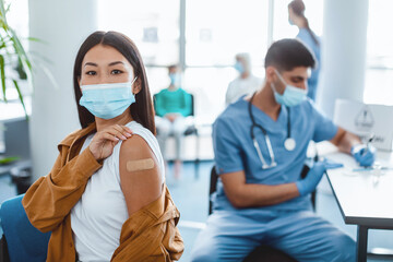 After Vaccination Concept. Portrait Of Vaccinated Asian Woman In Mask Showing Arm Getting Antiviral...