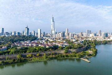 Skyline of Nanjing with modern skyscrapers and natural landscape along the river during daylight