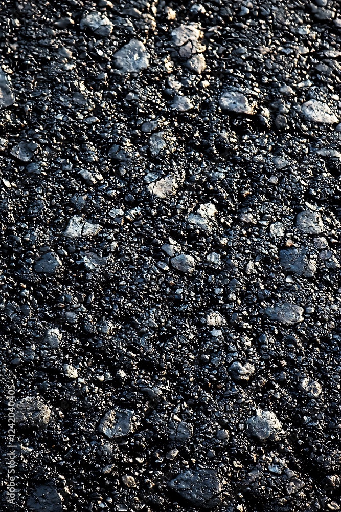 Poster a black smooth asphalt road texture background viewed from the top, ideal for creating a sleek and m