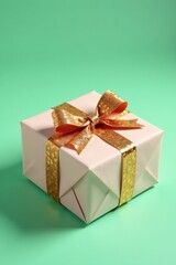 Obraz premium Luxurious gift wrapped in elegant paper with gold sequins on mint green backdrop, gift wrapping, festive luxury , gold accents