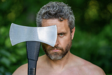 Brutality and masculinity. Hispanic serious man logging with axe. Lumberjack axe. Man with logging...