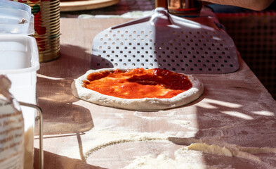 Making of fresh Italian pizza, street food, Portobello road food market on Saturday, London, UK