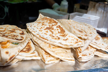 Mediterranean cuisine, fire-roasted bread flatbreads filled with cheese