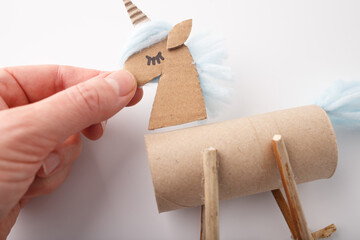 attaching head to body, step in creative process, assembling details in project