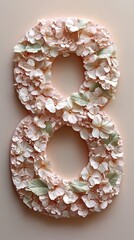 Obraz premium Decorative floral number eight made from delicate pink petals and green leaves arranged on a neutral background