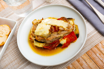 Just cooked eggplants with ground meat and cheese served on table.