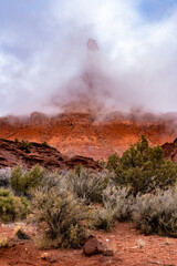 USA, Utah. Low clouds surrounding Castle Rock Spire, Castle Valley.