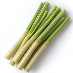 Fototapeta premium Fresh lemongrass stalks arranged on a white isolated background.