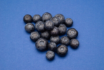 Fresh Blueberries on a blue background
