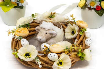 Easter wreath with lamb and floral decorations
