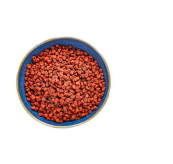 Bixa Orellana - Organic red annatto seeds in the bowl.