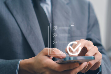 Businessman touching approved document icon on digital documents for approve business project proposals. Quality assurance and online evaluation of business concept. document management concept.