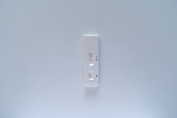 Positive Covid test on a white table