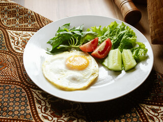 fried egg with vegetables