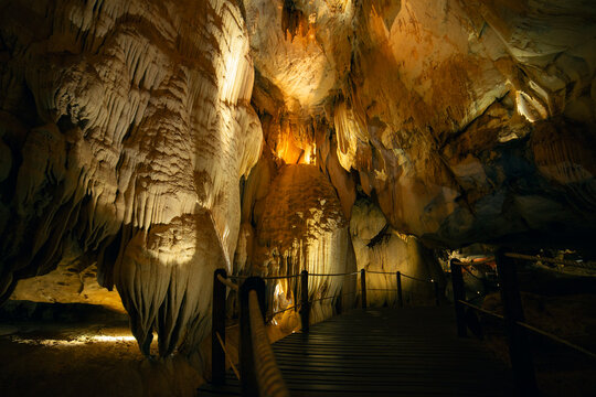 Cave Path Under Hanging Limestone Formations