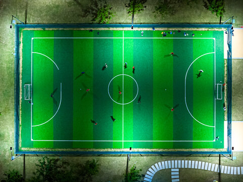 Aerial top view from flying drone of the football field