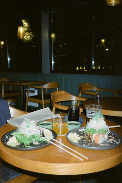 Delicious table of Japanese food: sushi, salmon, shoyu and chopsticks