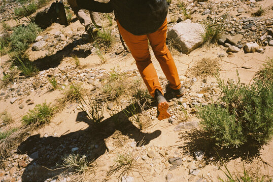 Hiking with shadow on trail