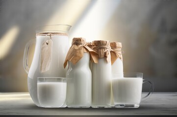 Glass and jug with tasty fresh healthy milk