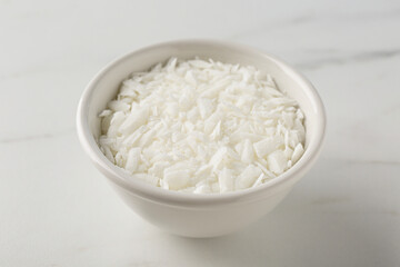 Soy wax in bowl on white marble table