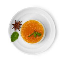 Tasty pudding with caramel sauce and mint isolated on white, top view