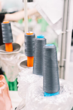 Spools of thread in a textile workshop during fabric production